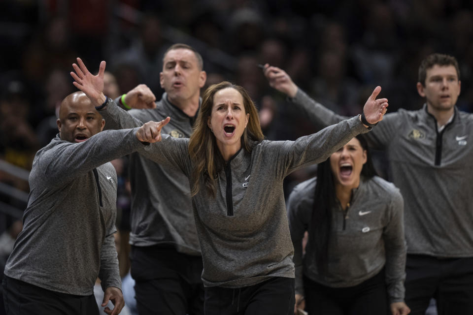 Colorado coach JR Payne, center, protests a call during the first half of the team's Sweet 16 college basketball game against Iowa in the women's NCAA tournament Friday, March 24, 2023, in Seattle. (AP Photo/Stephen Brashear)