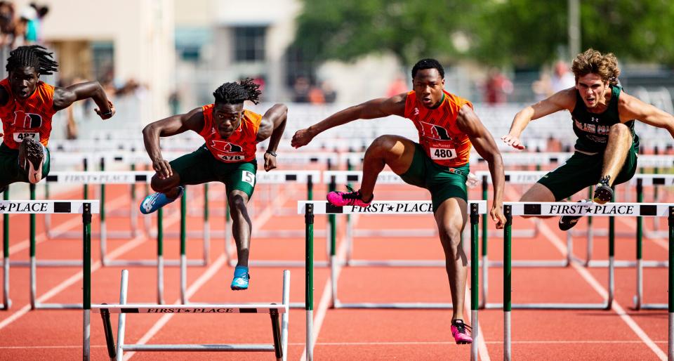 From left, Dunbar's James Little, Jabari Brown, Bobby Dennis and Island Coast's Glenn Green compete in the  110 meter hurdles during the Lee County Athletic Conference Championships at Dunbar High School on Saturday, April 9, 2022. Dennis won.