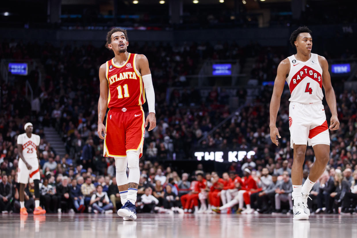 Trae Young, left, and Scottie Barnes will play in the All-Star Game. (Cole Burston/Getty Images