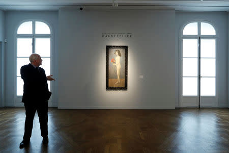 Jonathan Rendell, deputy chairman and senior advisor Christie's Americas stands next to 'Fillette a la corbeille fleurie' by Pablo Picasso from the collection of Peggy and David Rockefeller during a sale preview at Christie's auction house in Paris, France March 13, 2018. Picture taken March 13, 2018. REUTERS/Gonzalo Fuentes