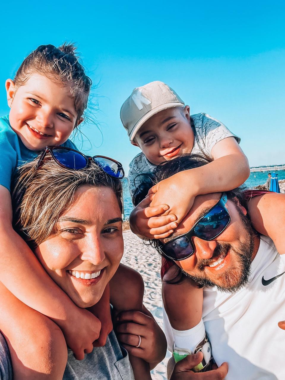 Jessica and Kyle Davenport and their two kids, Paizlee and Kruz. Both children had stem cell and kidney transplants to alleviate symptoms from a rare genetic disorder.