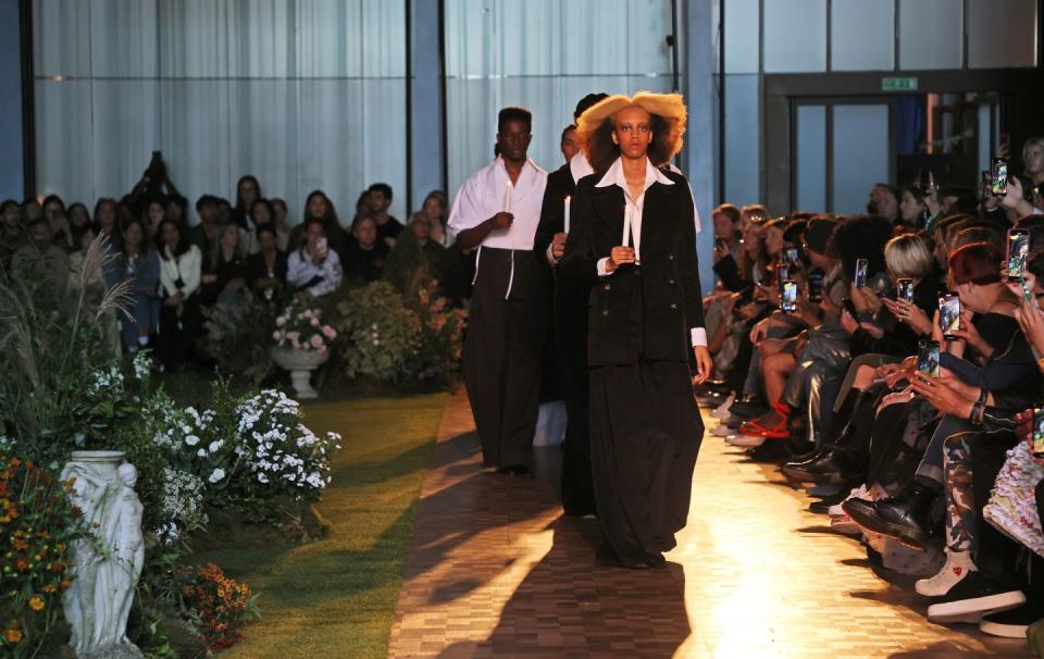 <p>The S.S. Daley show opened with a sombre candlelight vigil, as models wearing black and white walked the runway to a soundtrack of ringing church bells. </p>