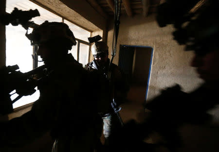 Afghan army Special Forces take part in a military exercise in Rishkhur district outside Kabul, Afghanistan March 12, 2017. Picture taken on March 12, 2017. REUTERS/Omar Sobhani