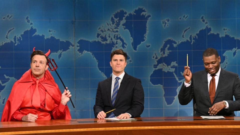 From left, Jason Sudeikis as The Devil, anchor Colin Jost, and anchor Michael Che during “SNL’s” Weekend Update on Saturday, Oct. 23, 2021. (Will Heath/NBC)