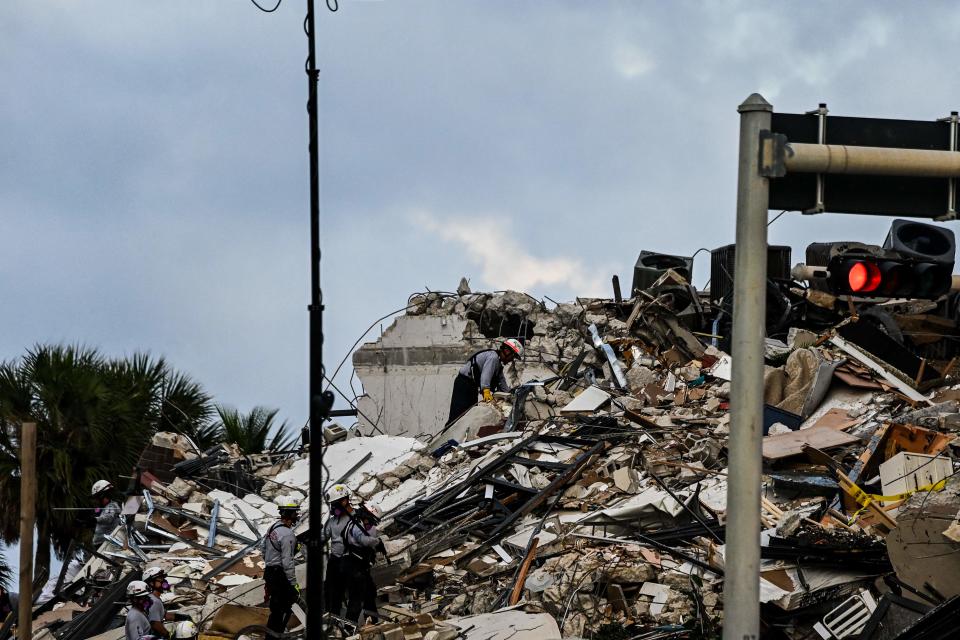 Search and Rescue personnel work at a partial collapse building in Surfside, Miami Beach (AFP via Getty Images)