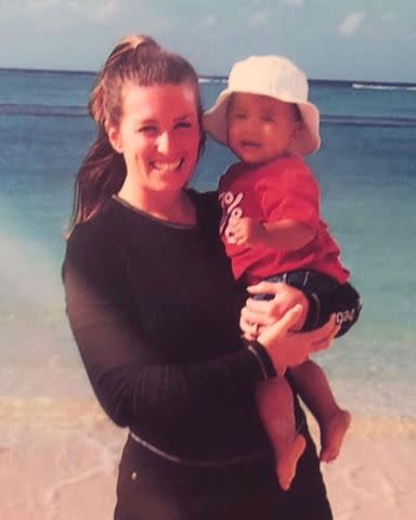 <p>Maya Brady/Instagram</p> Maya Brady being held by with her mom Maureen Brady as a child.