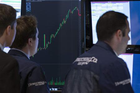 Traders work on the floor of the New York Stock Exchange April 21, 2014. REUTERS/Brendan McDermid