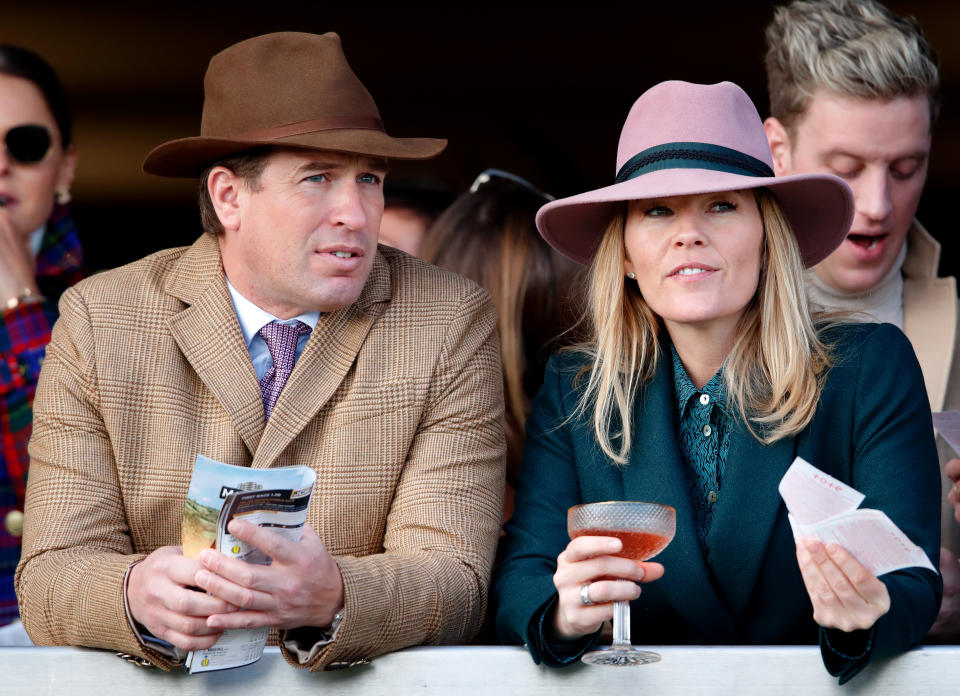 CHELTENHAM, UNITED KINGDOM - MARCH 13: (EMBARGOED FOR PUBLICATION IN UK NEWSPAPERS UNTIL 24 HOURS AFTER CREATE DATE AND TIME) Peter Phillips and Autumn Phillips watch the racing as they attend day 4 'Gold Cup Day' of the Cheltenham Festival 2020 at Cheltenham Racecourse on March 13, 2020 in Cheltenham, England. (Photo by Max Mumby/Indigo/Getty Images)