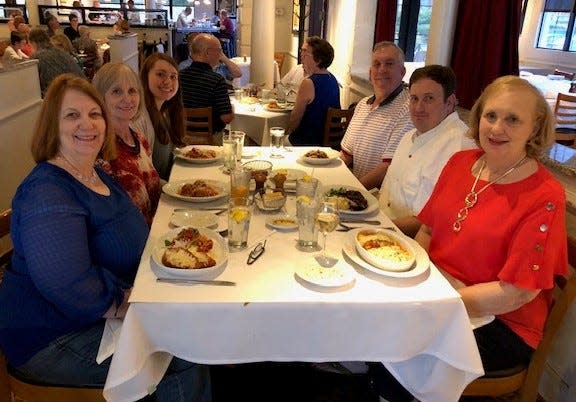 At a Louisville restaurant they’d not visited before, the Speelman clan follows a long-standing family tradition on the Friday night before the 2019 Derby. Clockwise from left, Patti Speelman, Jacci Rodgers, Rachel Rodgers, Joe Rodgers, Nicholas Thorpe, and Marcia Thorpe