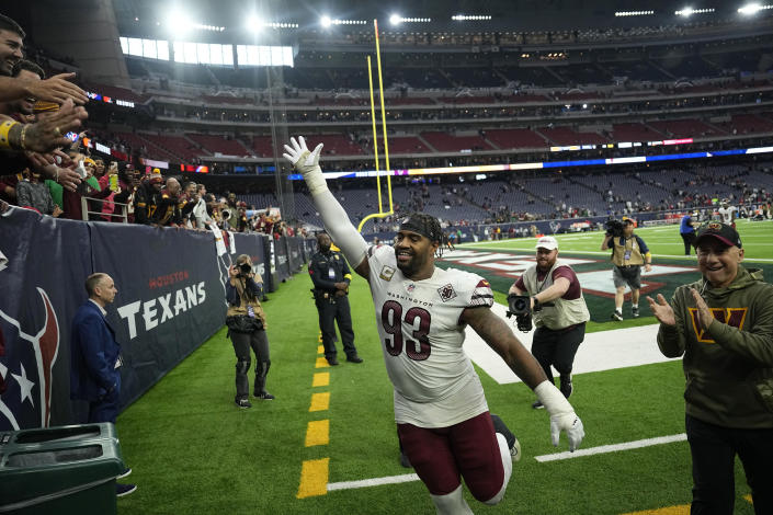 Washington Commanders defensive tackle Jonathan Allen (93) runs off the field following the team's win over the Houston Texans in an NFL football game Sunday, Nov. 20, 2022, in Houston. (AP Photo/David J. Phillip)