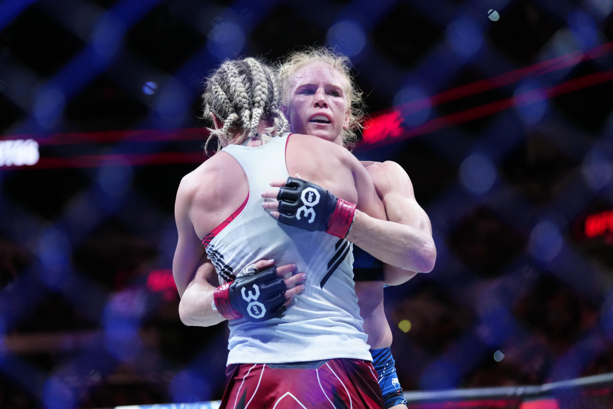 SAN ANTONIO, TEXAS - MARCH 25: (R-L) Holly Holm hugs Yana Santos in their Women's Bantamweight fight during the UFC on ESPN 43 event at AT&T Center on March 25, 2023 in San Antonio, Texas, USA. (Photo by Louis Grasse/PxImages/Icon Sportswire via Getty Images)