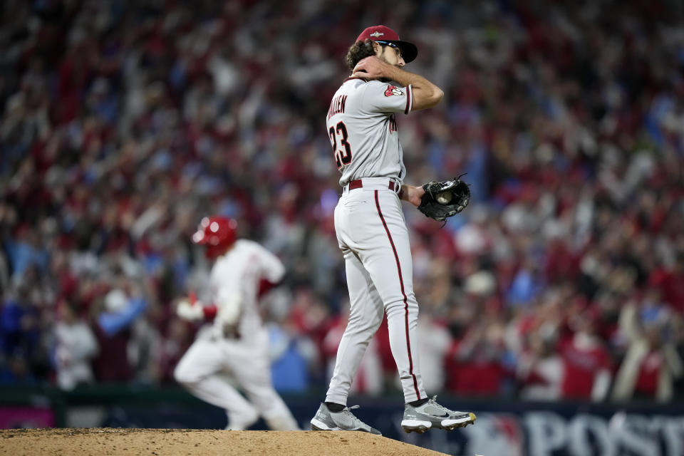 Arizona Diamondbacks starting pitcher Zac Gallen races after giving up a home run tp Philadelphia Phillies' Nick Castellanos during the eighth inning in Game 1 of the baseball NL Championship Series in Philadelphia, Monday, Oct. 16, 2023. (AP Photo/Matt Slocum)