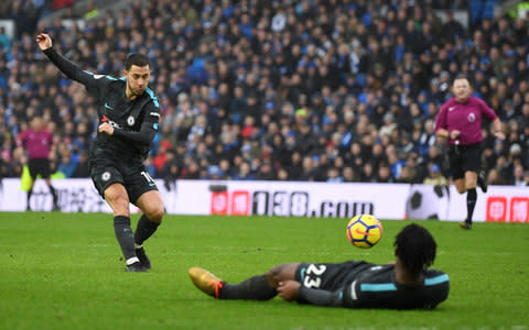 Eden Hazard of Chelsea scores his sides third goal during the Premier League match between Brighton and Hove Albion and Chelsea at Amex Stadium on January 20, 2018 in Brighton, England - Credit: Getty Images