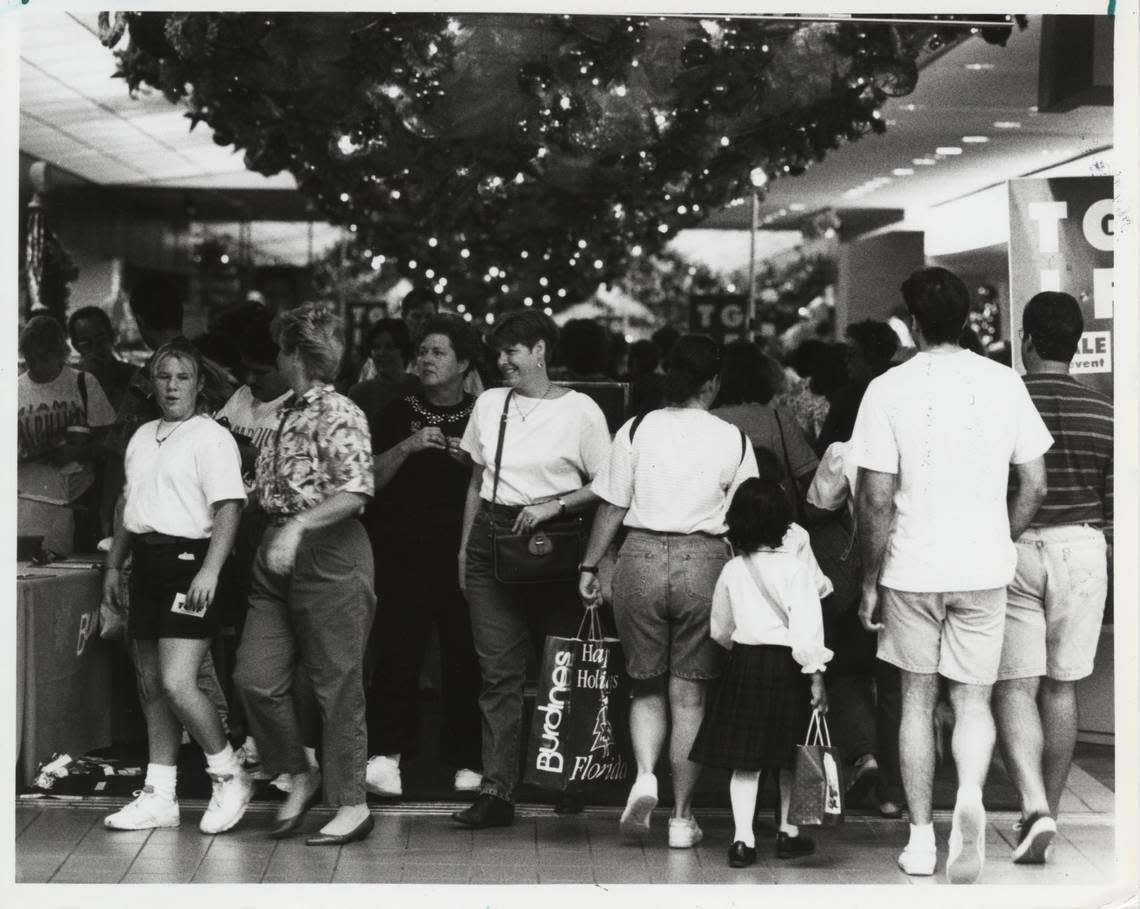 Dadeland Mall has been serving Miami-Dade County shoppers since it opened in 1962. Above: Shoppers crowd an entrance to Burdines in the Dadeland Mall in 1992.
