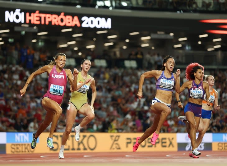 <span class="article__caption">BUDAPEST, HUNGARY – AUGUST 19: Anna Hall of Team United States and Katarina Johnson-Thompson of Team Great Britain compete in heat 3 of Heptathlon – Women’s 200m during day one of the World Athletics Championships Budapest 2023 at National Athletics Centre on August 19, 2023 in Budapest, Hungary. (Photo by Steph Chambers/Getty Images)</span>