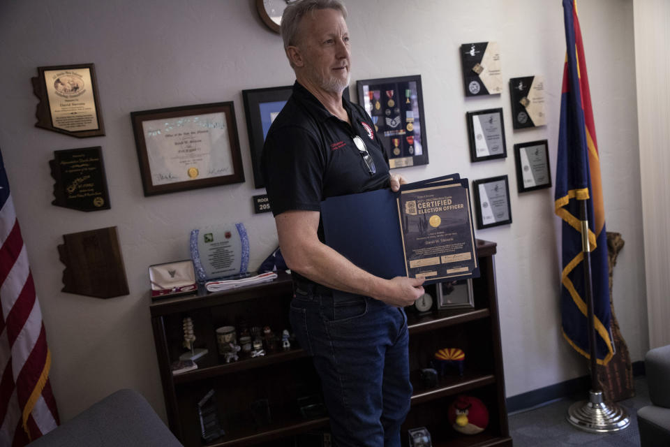 Cochise County Recorder David Stevens poses for a portrait inside his office in Bisbee, Ariz., Tuesday, Feb. 14, 2023. Stevens was prepared to oversee Cochise's hand count when former elections director Lisa Marra, objected last year, only halting once a judge ruled it violated state law. He has appealed that ruling and recently joined a nonprofit founded by Rep. Mark Finchem to focus on election “integrity.” (AP Photo/Alberto Mariani)