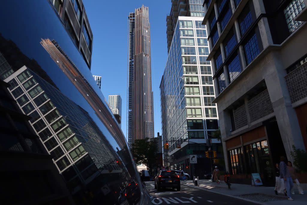 The Brooklyn Tower is reflected in the window of a truck on October 9, 2022, in New York City.