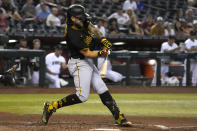 Pittsburgh Pirates' Michael Chavis hits a solo home run against the Arizona Diamondbacks during the sixth inning of a baseball game Tuesday, Aug. 9, 2022, in Phoenix. (AP Photo/Rick Scuteri)