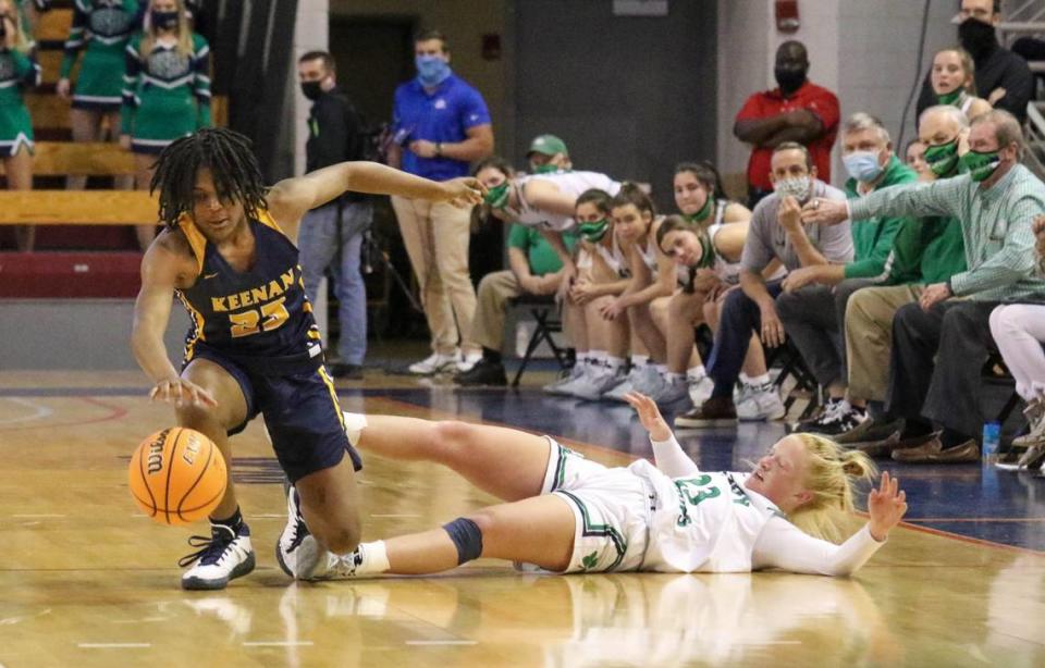 Keenan’s MiLaysia Fulwiley (23) regains control of a ball swiped by Bishop England’s Lily Woods (23) during the 3A state championship game at the USC Aiken Convocation Center on Friday, March 5, 2021.