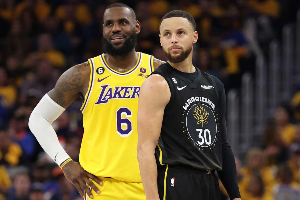 <p>Ezra Shaw/Getty </p> LeBron James and Steph Curry pictured during the 2023 NBA playoffs