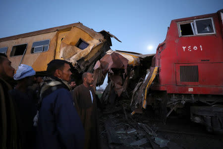 Rescue workers look at the wreckage after a train crash in Kom Hamada in the northern province of Beheira, Egypt, February 28, 2018. REUTERS/Mohamed Abd El Ghany