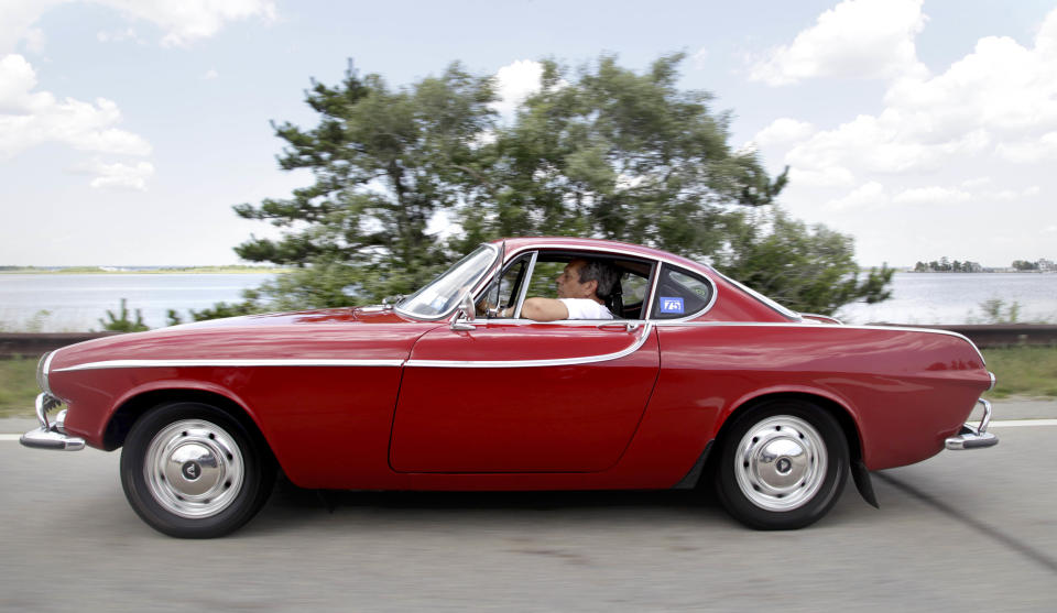 Irv Gordon drives his Volvo P1800 in Babylon, N.Y., Monday, July 2, 2012. Gordon's car already holds the world record for the highest recorded milage on a car and he is less than 40,000 miles away from passing three million miles on the Volvo. (AP Photo/Seth Wenig)