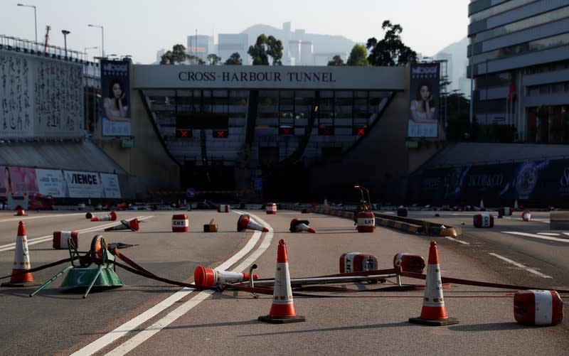 Traffic cones stand on the road leading to the Cross Harbour Tunnel in Hong Kong