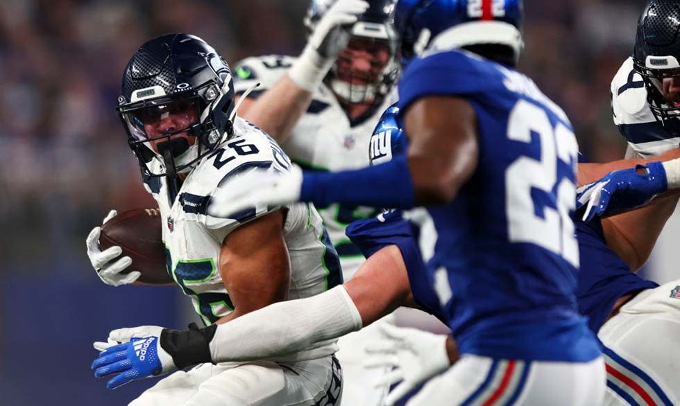 Zach Charbonnet #26 of the Seattle Seahawks carries the ball during the third quarter of an NFL football game against the New York Giants at MetLife Stadium on October 2, 2023 . 