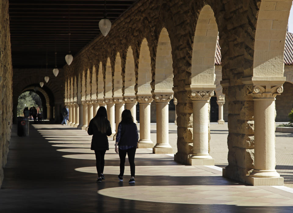 FILE - Students walk on the Stanford University campus on March 14, 2019, in Stanford, Calif. Hidden inside the foundation of popular artificial intelligence image-generators are thousands of images of child sexual abuse, according to a new report from the Stanford Internet Observatory that urges technology companies to take action to address a harmful flaw in the technology they built. (AP Photo/Ben Margot, File)