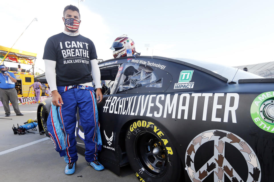 <p>Bubba Wallace — NASCAR's only black full-time driver — shows his support for the Black Lives Matter movement ahead of a NASCAR Cup Series auto race in Martinsville, Virginia, on Wednesday. Earlier in the day, the pro racing organization <a href="https://people.com/sports/driver-bubba-wallace-on-nascar-banning-confederate-flag/" rel="nofollow noopener" target="_blank" data-ylk="slk:banned any display of the Confederate flag;elm:context_link;itc:0;sec:content-canvas" class="link ">banned any display of the Confederate flag</a> at its events.</p>