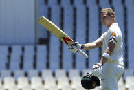 Australia's batsman Steven Smith raises his bat after reaching his century on the second day of their their cricket test match against South Africa at Centurion Park in Pretoria, South Africa, Thursday, Feb. 13, 2014. (AP Photo/ Themba Hadebe)