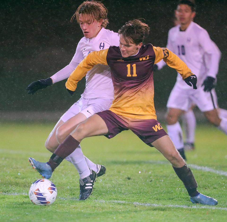 Walsh Jesuit's Carter Madden cuts off a pass in front of Hoban's Joel McRaven in a Division I sectional game on Tuesday, Oct. 18, 2022 in Cuyahoga Falls.