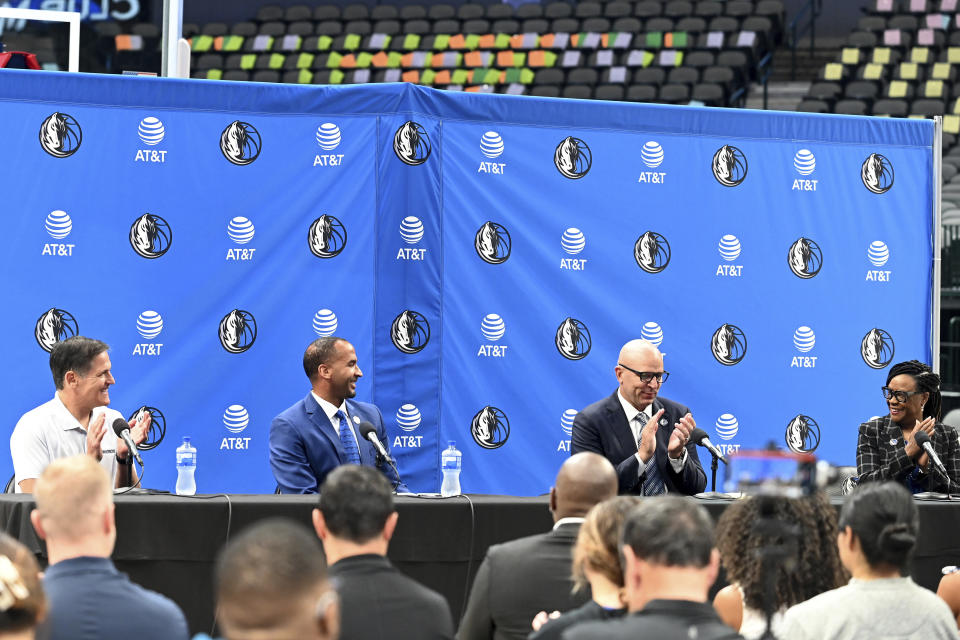 From left, Dallas Mavericks NBA basketball team owner Mark Cuban, new general manager Nico Harrison, new head coach Jason Kidd and Cynt Marshall, CEO, reacts during a press conference formally introducing Kidd and Harrison, Thursday, July 15, 2021, in Dallas. (AP Photo/Matt Strasen)