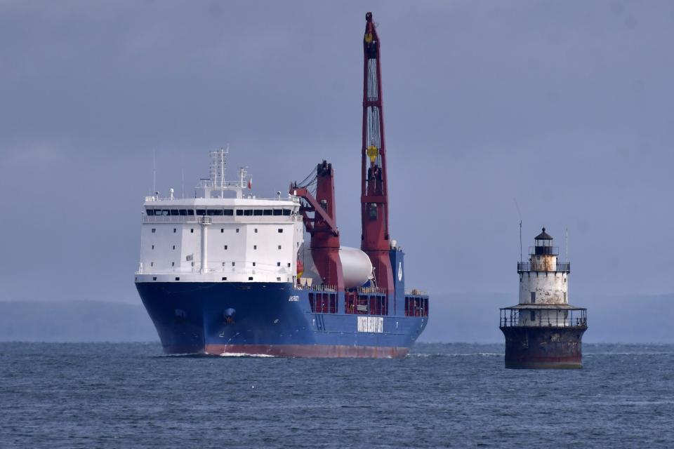 The ship UHL Felicity, carrying wind turbine tower sections, arrives Wednesday, May 24, 2023, to dock in New Bedford, Mass. Once assembled by developer Vineyard Wind, the turbines at sea will stand more than 850 feet high. (AP Photo/Josh Reynolds)