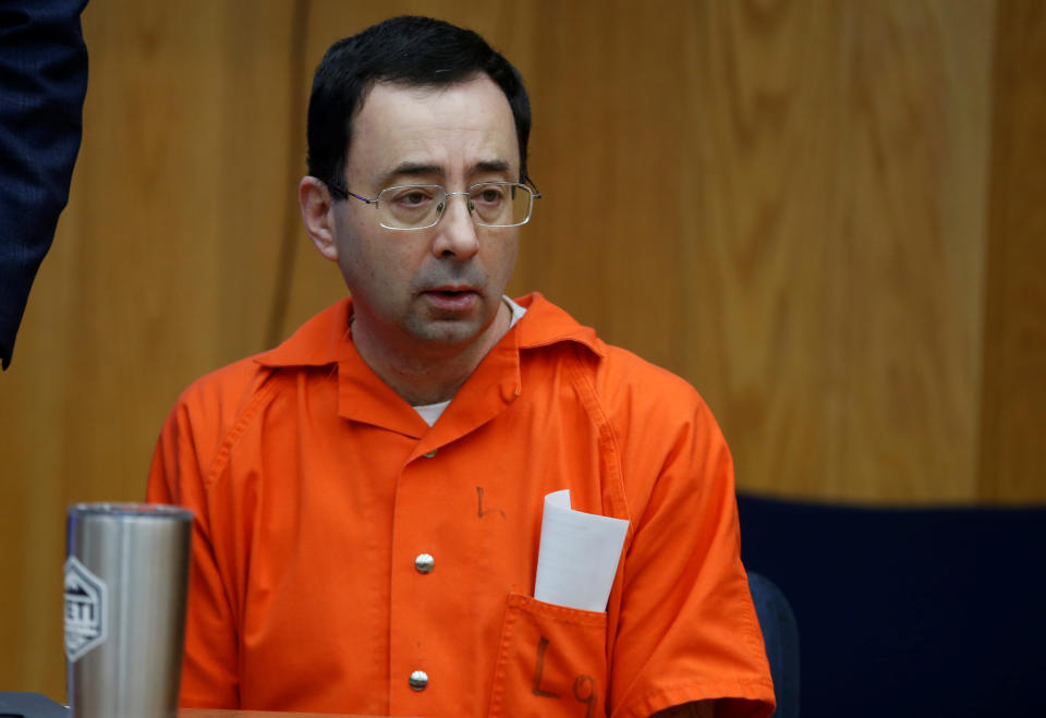 Larry Nassar, a former team USA Gymnastics doctor who pleaded guilty in November 2017 to sexual assault charges, sits in the court room during victim statements of his second sentencing in the Eaton County Circuit Court in Charlotte, Michigan, U.S., January 31, 2018.   REUTERS/Rebecca Cook