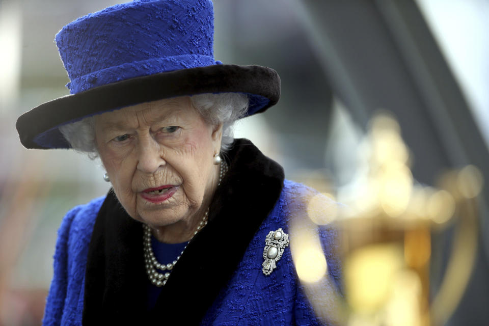 Britain's Queen Elizabeth ahead of presenting the trophy, after the British Champions Fillies & Mares Stakes during the British Champions Day at Ascot Racecourse, in Ascot, England, Saturday, Oct. 16, 2021. (Steven Paston/PA via AP)