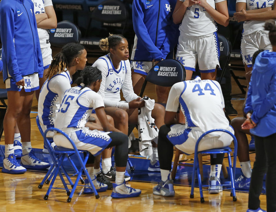 A somber Kentucky bench in the closing minutes of the second half of a college basketball game against Iowa in the second round of the women's NCAA tournament at the Greehey Arena in San Antonio, Tuesday, March 23, 2021. Iowa defeated Kentucky 86-72. (AP Photo/Ronald Cortes)