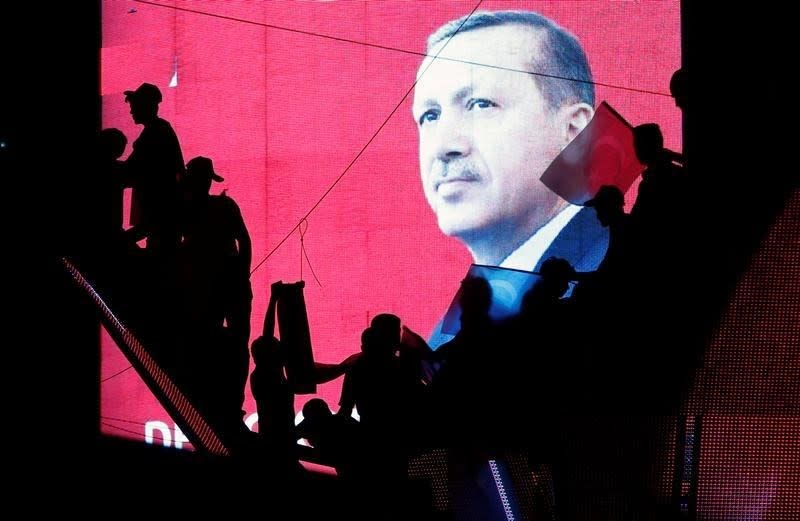 Turkish Supporters are silhouetted against a screen showing President Tayyip Erdogan during a pro-government demonstration in Ankara, Turkey, July 17, 2016. REUTERS/Baz Ratner