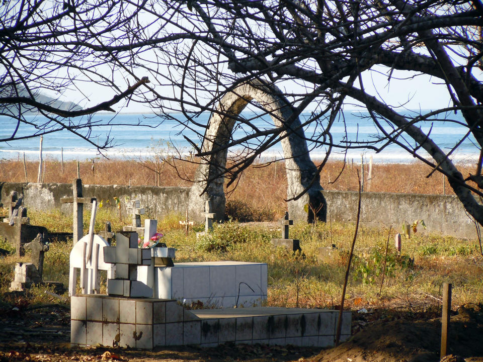 This February 2014 photo released by Kristina MacKulin shows a small cemetery alongside Playa Guiones in Nosara, Costa Rica. Nosara is a scenic coastal region with a variety of outdoor recreation activities for visitors. (AP Photo/Kristina MacKulin)