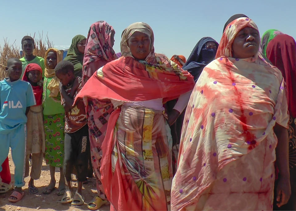 Sudanese refugees displaced by the conflict in Sudan gather to receive food staples from aid agencies at the Metche Camp in eastern Chad Tuesday, March 5, 2024. Overcrowded refugee camps in eastern Chad are set to run out of money soon, exacerbating a dire humanitarian crisis caused by the spillover from the war in Sudan, the United Nations said. (AP Photo/Jsarh Ngarndey Ulrish)