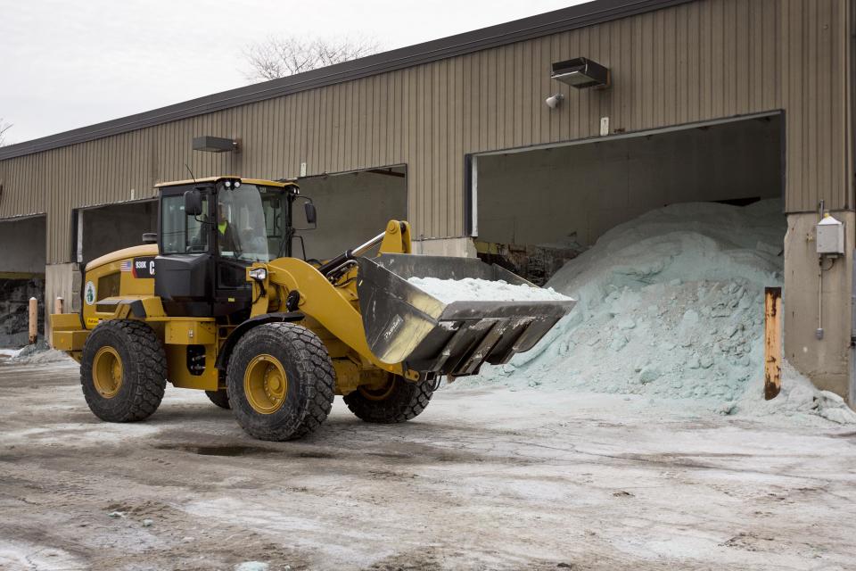 Road salt is unloaded from storage at the public works facility in Glen Ellyn, Ill., on Tuesday, Feb. 4, 2014. The Midwest's recent severe winter weather has caused communities to expend large amounts of their road salt supplies. (AP Photo/Andrew A. Nelles)