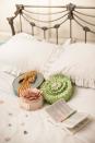 Cake and sweets adorn the bed for the lucky guests who get to stay at the cake hotel - guaranteeing sweet dreams. There are three floors and eight rooms, filled with more than 100 edible treats for guests to feast on - even edible books (Tate & Lyle)