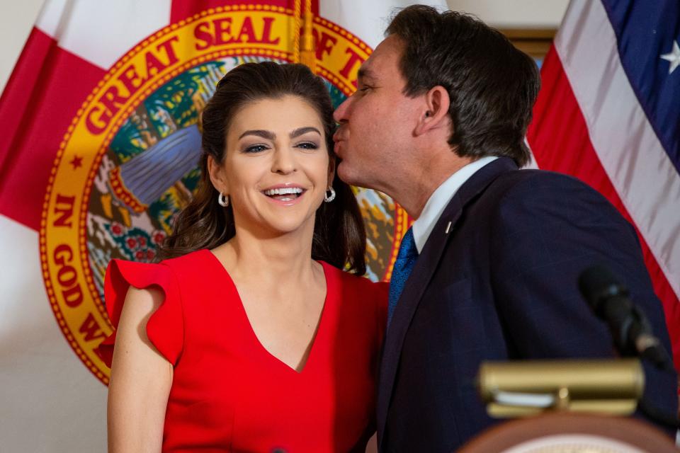 Gov. Ron DeSantis kisses his wife, Casey DeSantis inside the Florida Governors Mansion after mentioning that it is Valentine's Day while introducing the Cancer Connect Collaborative roundtable discussion, Wednesday, Feb. 14, 2024.