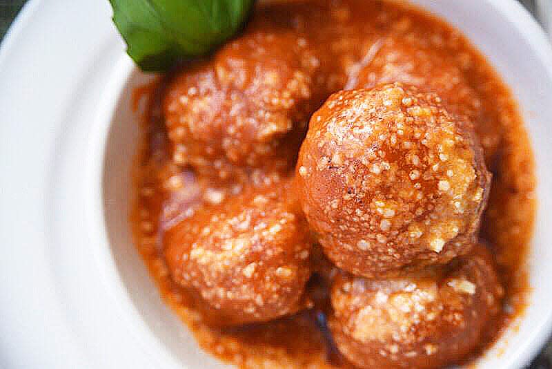 The veal-and-beef meatballs at Al Fresco are covered in a slightly spicy red sauce made with San Marzano tomatoes and served with ricotta cheese.