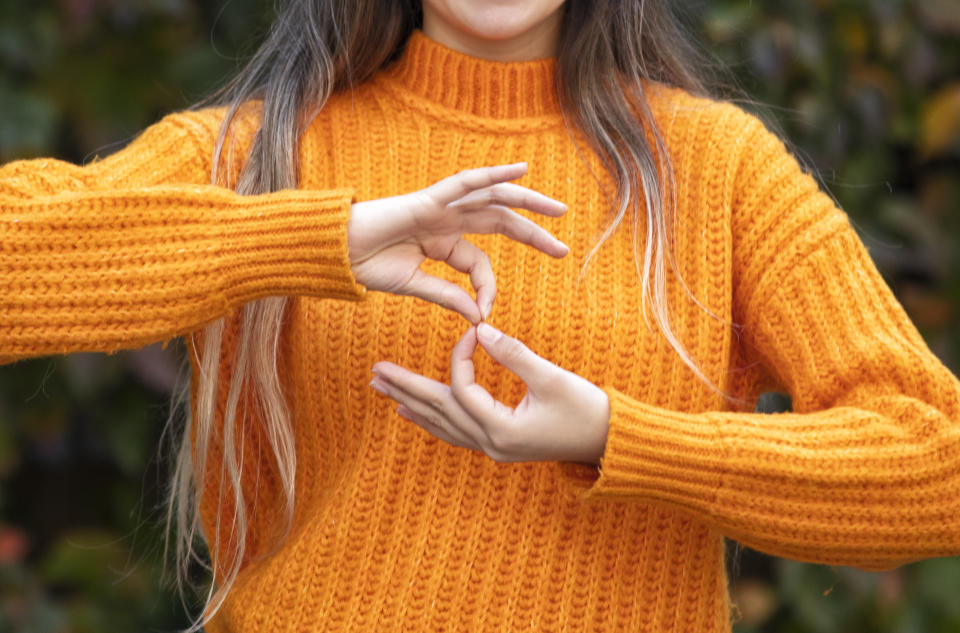 Deaf woman using sign language