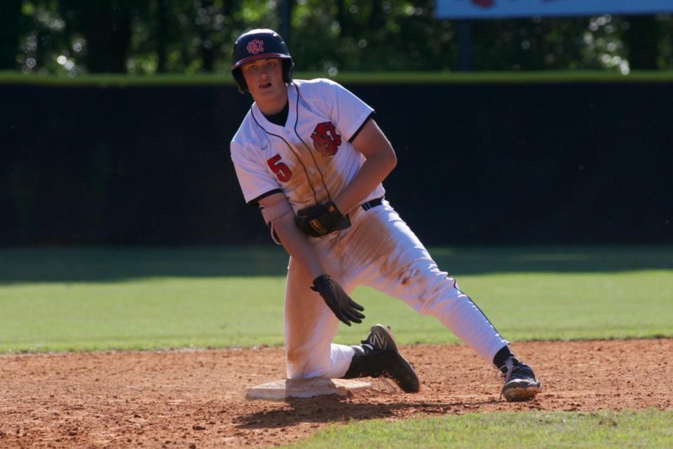 NFC sophomore pitcher Garrett Workman (5) celebrates after reaching second base in a game against Wakulla on April 19, 2022, at North Florida Christian. The Eagles won 8-2.