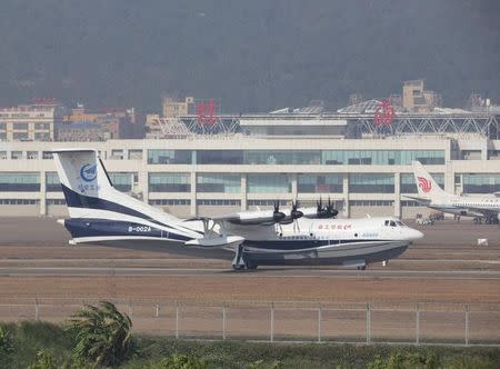 China's domestically developed AG600, the world's largest amphibious aircraft, lands at an airport after its maiden flight in Zhuhai, Guangdong province, China December 24, 2017. REUTERS/Stringer