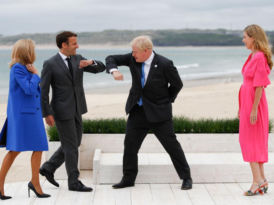 Boris Johnson and Carrie Johnson greet Emmanuel Macron and Brigitte Macron (POOL/AFP via Getty Images)