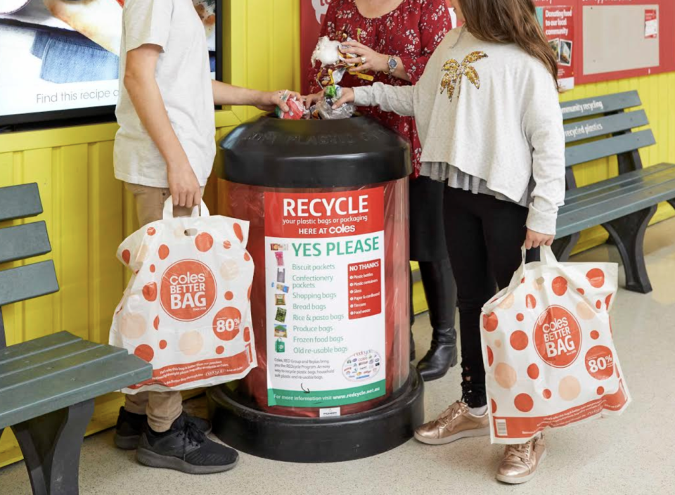 Shoppers placing soft plastics in a REDcycle bin outside a Coles store. Source: Coles 