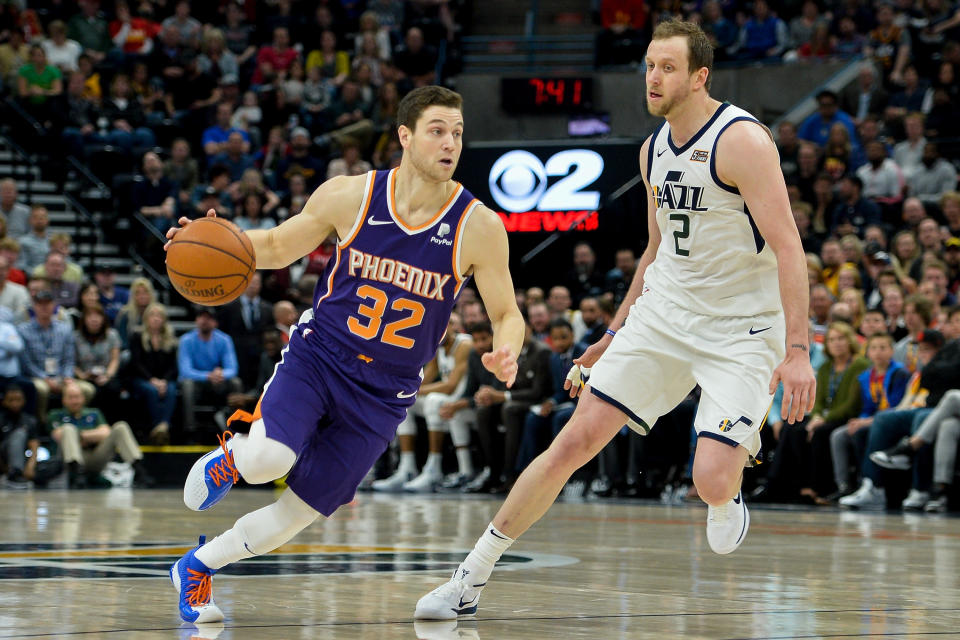 SALT LAKE CITY, UT - MARCH 25: Jimmer Fredette #32 of the Phoenix Suns drives around Joe Ingles #2 of the Utah Jazz during a game at Vivint Smart Home Arena on March 25, 2019 in Salt Lake City, Utah. NOTE TO USER: User expressly acknowledges and agrees that, by downloading and or using this photograph, User is consenting to the terms and conditions of the Getty Images License Agreement. (Photo by Alex Goodlett/Getty Images)